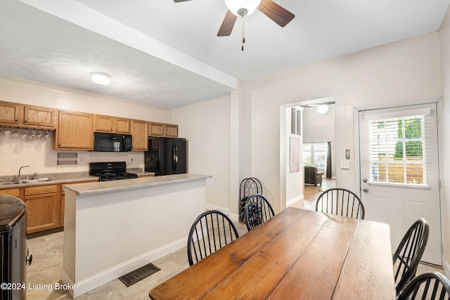 dining room featuring a ceiling fan, visible vents, and baseboards