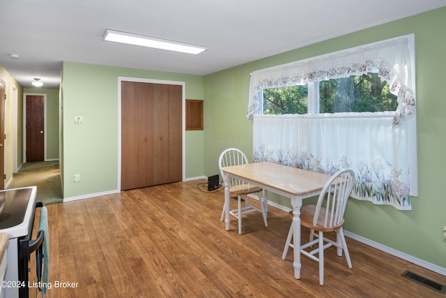 dining space featuring wood-type flooring