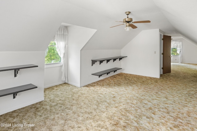 bonus room with ceiling fan, vaulted ceiling, carpet, and a wealth of natural light