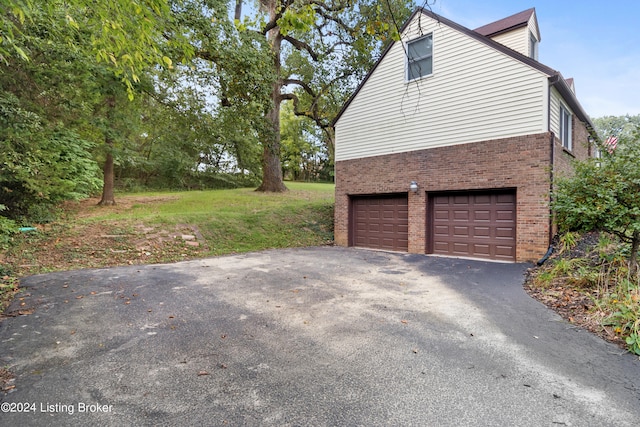 view of side of property with a garage