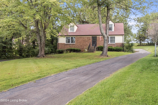 new england style home with a front yard