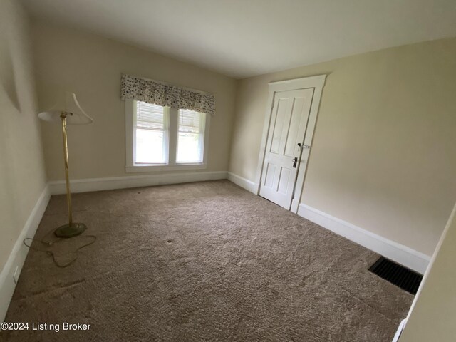 spare room featuring carpet flooring