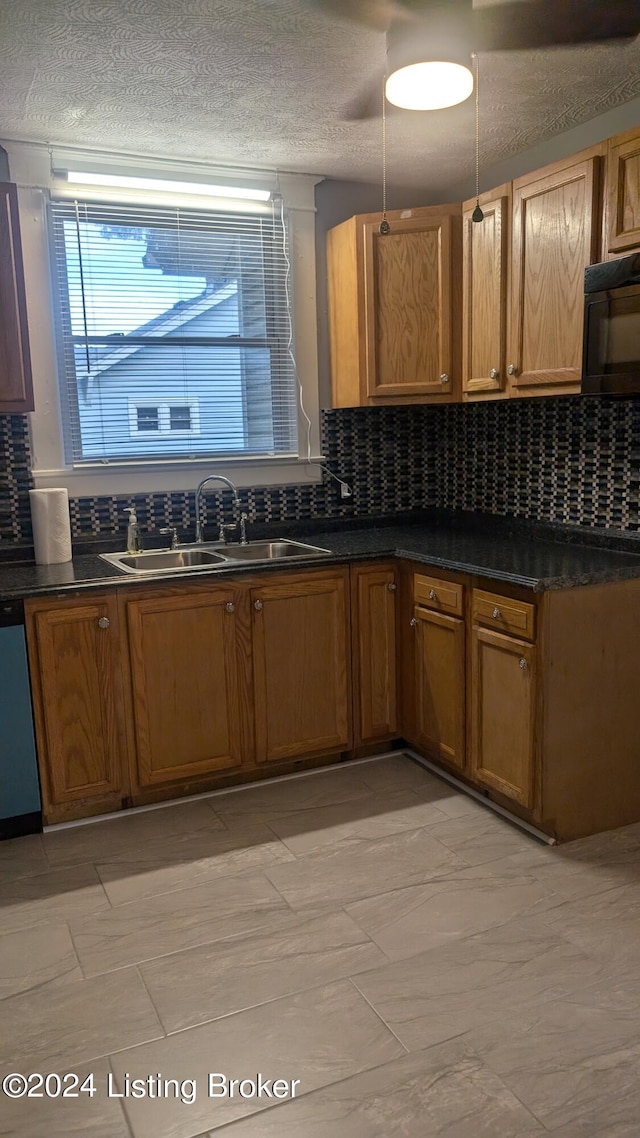 kitchen with light tile patterned flooring, tasteful backsplash, and sink