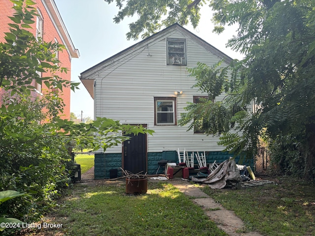 view of side of home featuring a yard