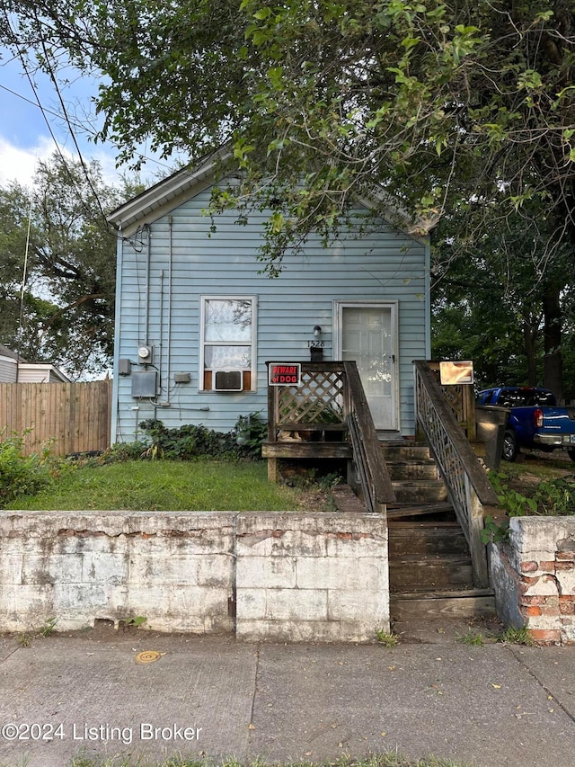 view of front of house featuring cooling unit