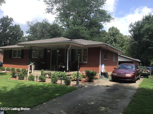 view of front of house featuring covered porch and a front lawn