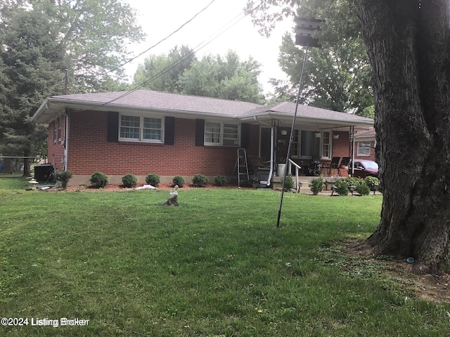 single story home featuring central AC and a front yard