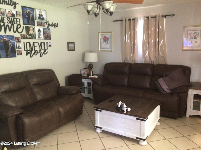 living room featuring light tile patterned floors and ceiling fan