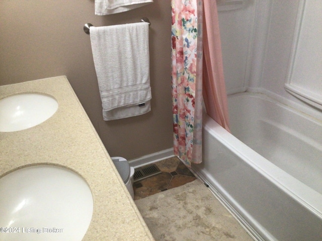 bathroom with vanity, tile patterned floors, and shower / bathtub combination with curtain