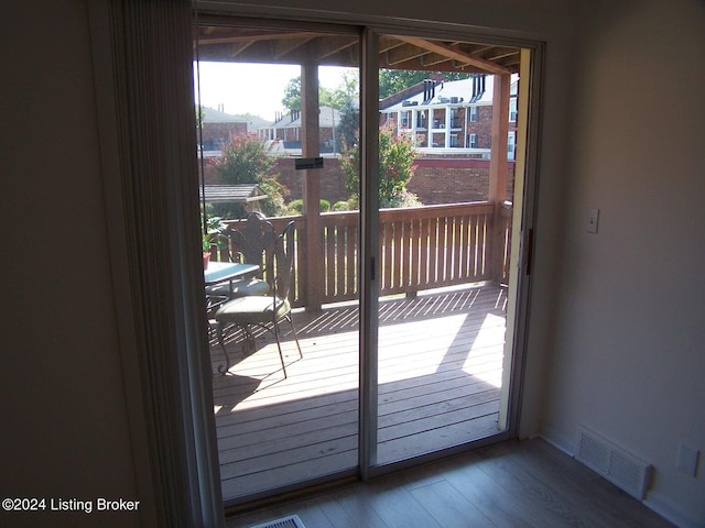 doorway to outside featuring hardwood / wood-style flooring