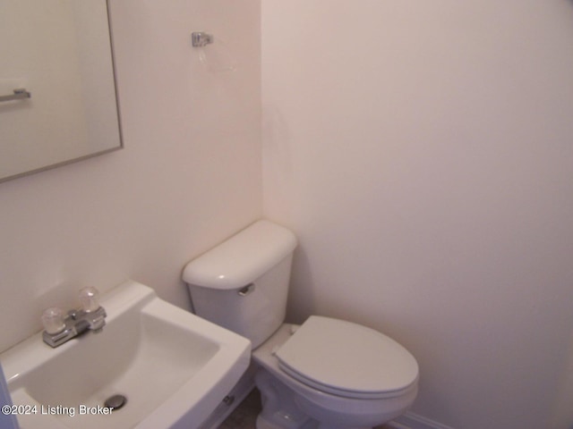 bathroom with sink and toilet