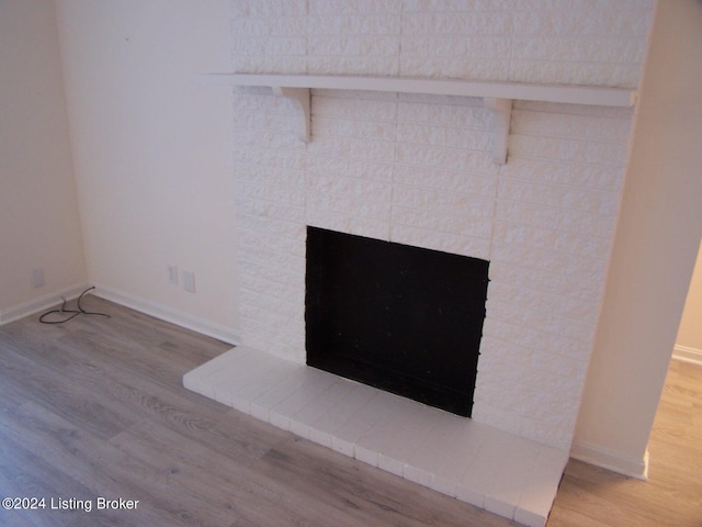 interior details with a fireplace and hardwood / wood-style floors