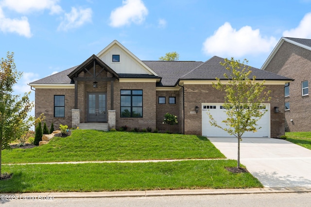 view of front of home with a garage and a front yard