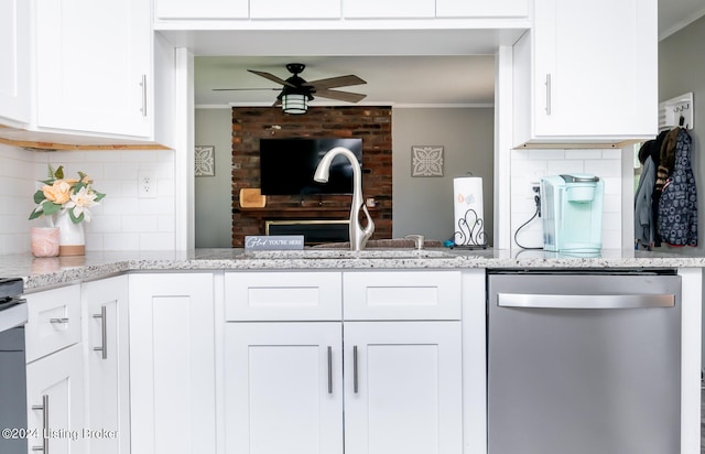 kitchen with stainless steel dishwasher, tasteful backsplash, and ornamental molding