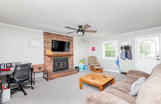 carpeted living room with ceiling fan, a fireplace, brick wall, and crown molding