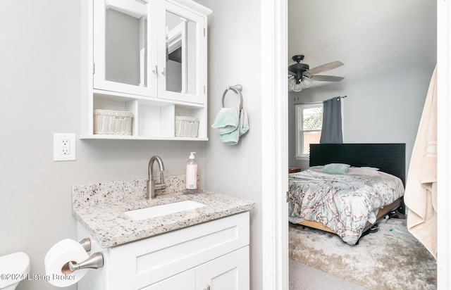 bedroom featuring ceiling fan and sink