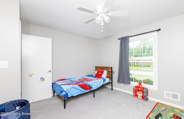 bedroom featuring ceiling fan and light colored carpet