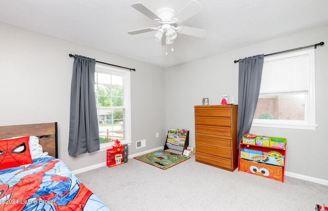 carpeted bedroom featuring ceiling fan