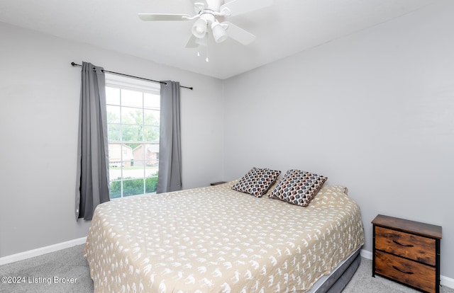 bedroom featuring ceiling fan and light colored carpet