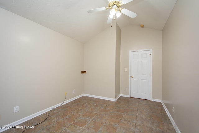 empty room with vaulted ceiling and ceiling fan