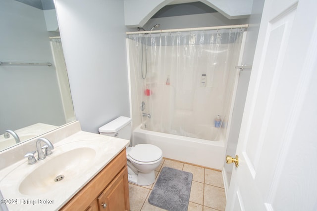 full bathroom featuring shower / bath combo with shower curtain, tile patterned flooring, vanity, and toilet