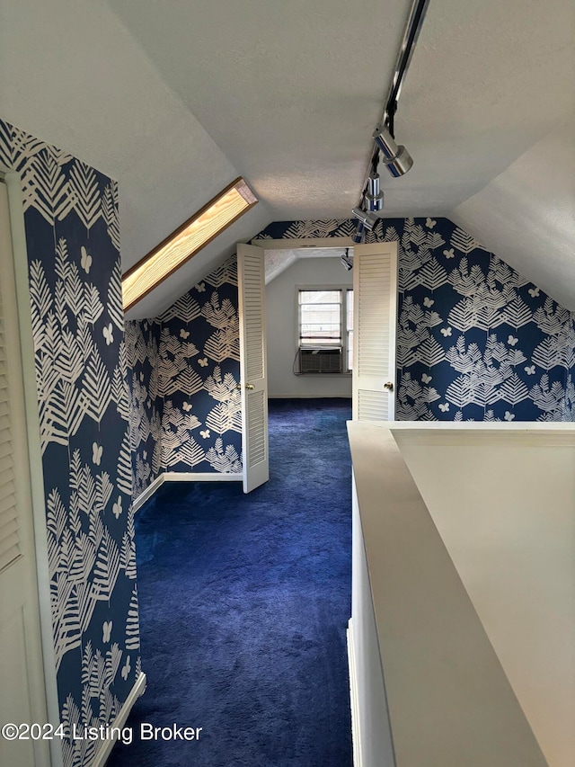 bonus room featuring carpet flooring and vaulted ceiling