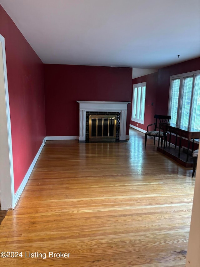 unfurnished living room featuring hardwood / wood-style floors