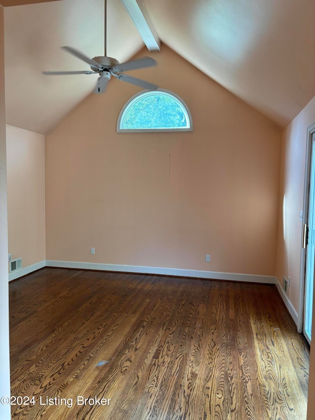 empty room featuring ceiling fan, hardwood / wood-style flooring, and lofted ceiling with beams