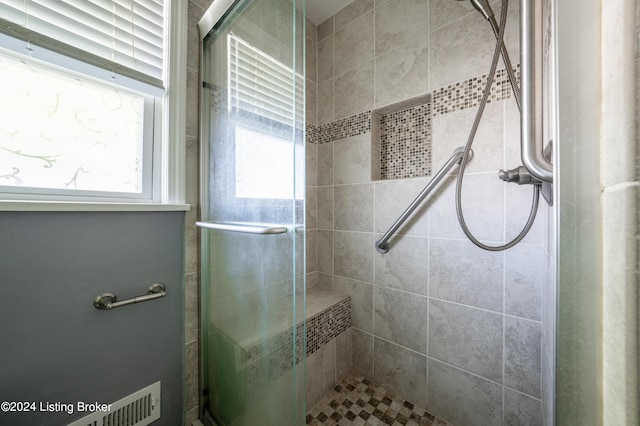 bathroom featuring walk in shower