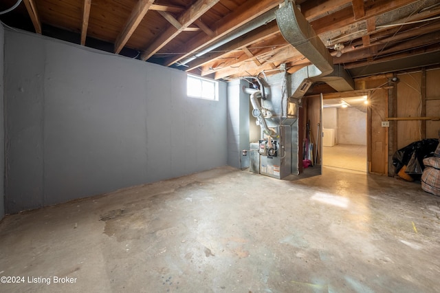 basement featuring heating unit