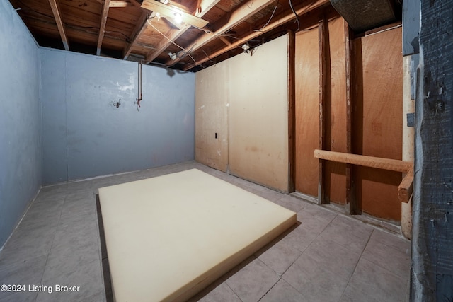 basement featuring tile patterned floors