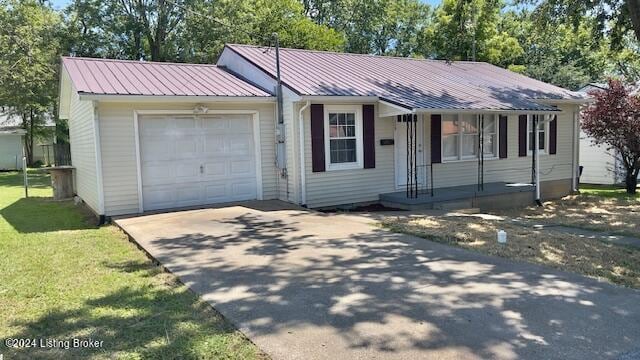 ranch-style house featuring a garage, metal roof, driveway, and a porch