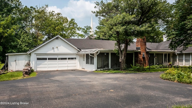 ranch-style house featuring a garage