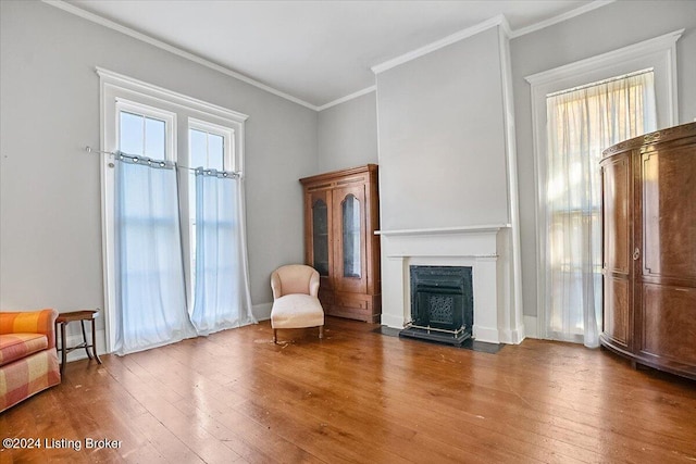 unfurnished room featuring crown molding and hardwood / wood-style flooring