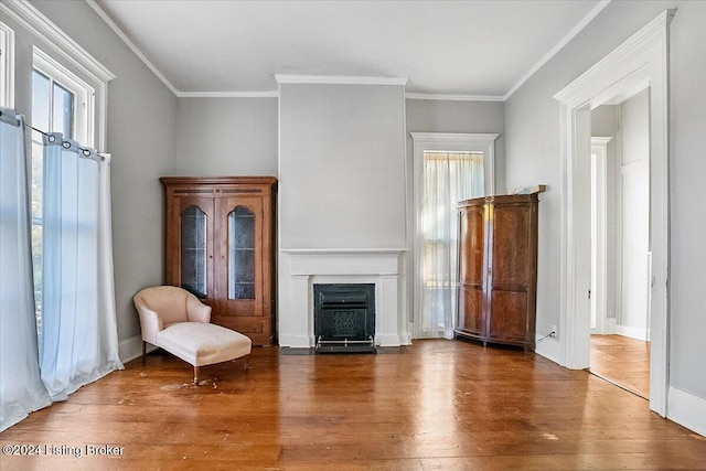 unfurnished room featuring hardwood / wood-style floors and ornamental molding