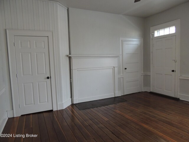 entryway with dark hardwood / wood-style flooring