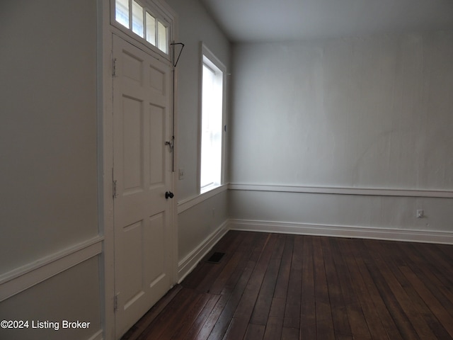 entrance foyer with dark hardwood / wood-style flooring