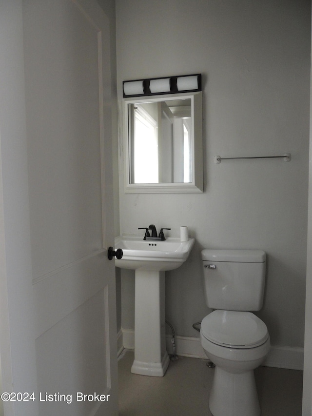 bathroom featuring sink and toilet