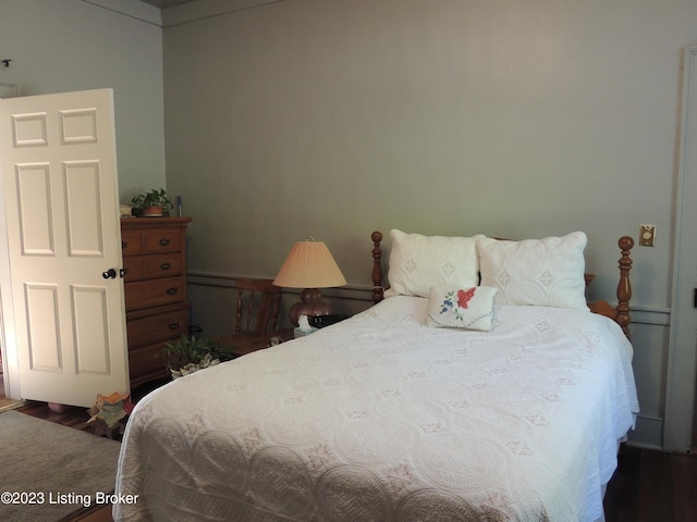 bedroom with hardwood / wood-style floors