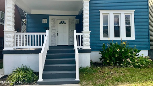 property entrance featuring covered porch