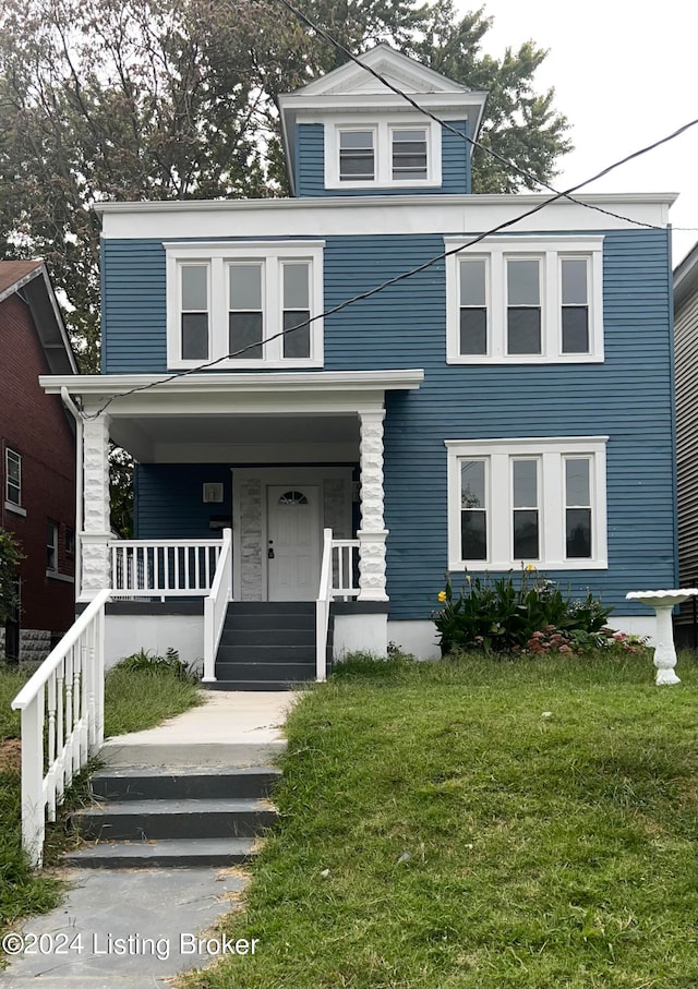 view of front facade with a porch and a front lawn