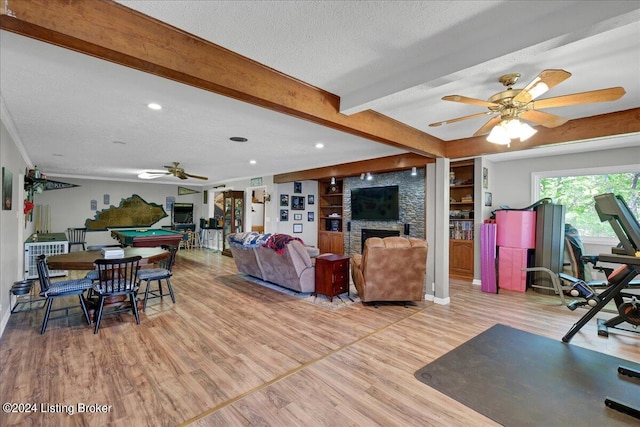 dining space with a textured ceiling, ceiling fan, beam ceiling, light hardwood / wood-style flooring, and billiards