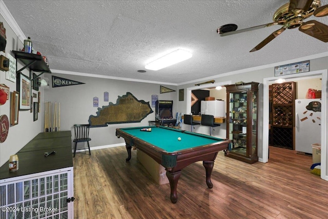 recreation room featuring ceiling fan, pool table, ornamental molding, and hardwood / wood-style flooring