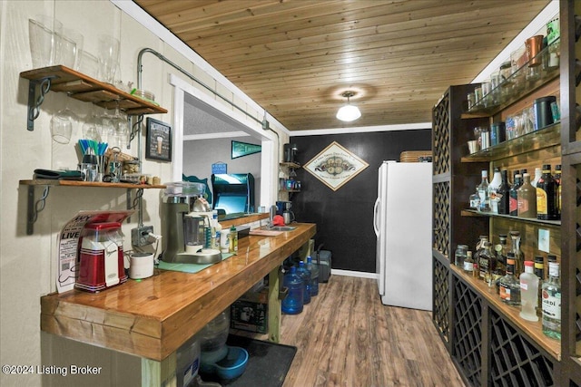 office space featuring wooden ceiling, ornamental molding, and wood-type flooring