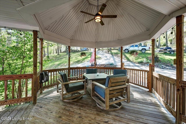 wooden deck featuring ceiling fan