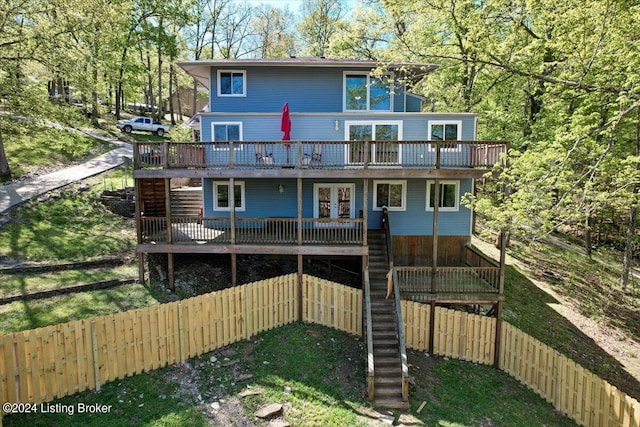 rear view of property with a wooden deck