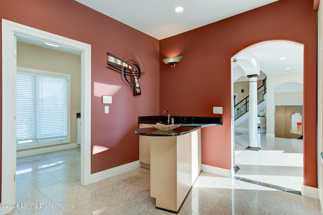 welcome area with sink and ornate columns