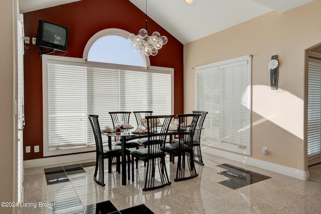 dining space with high vaulted ceiling, tile patterned flooring, and a notable chandelier