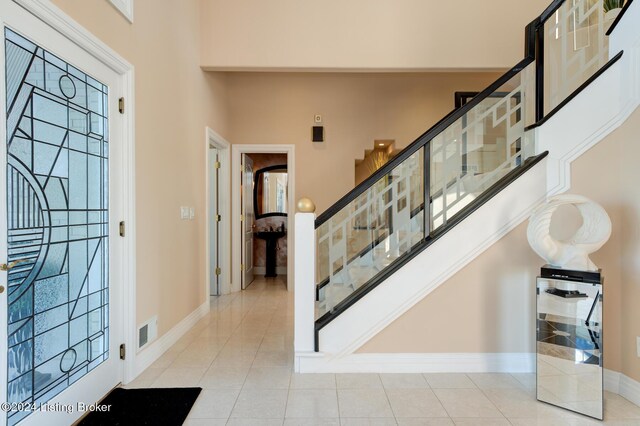 entryway featuring light tile patterned flooring