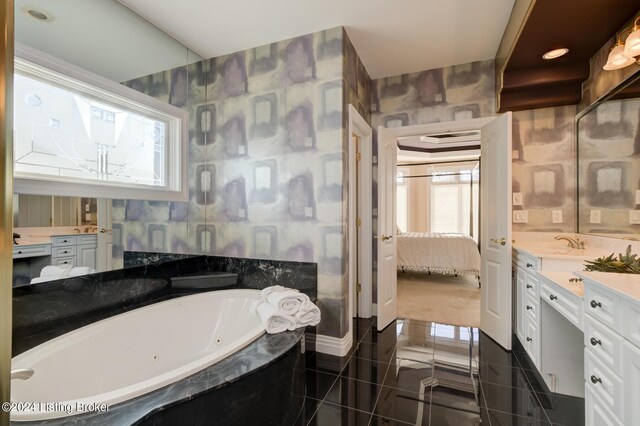 bathroom featuring tiled bath, tile patterned floors, vanity, and tile walls